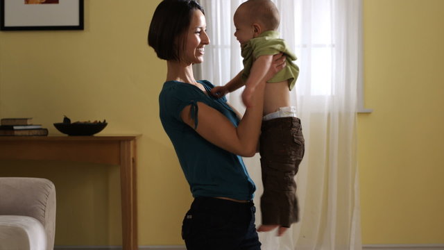 woman playing with her baby