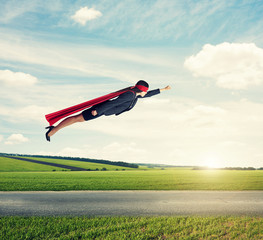 woman superhero flying at outdoor