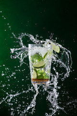Fototapeta na wymiar fresh mojito drink with liquid splash