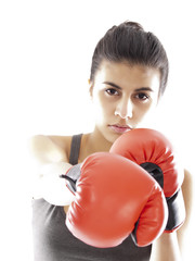 girl training martial arts with boxing gloves