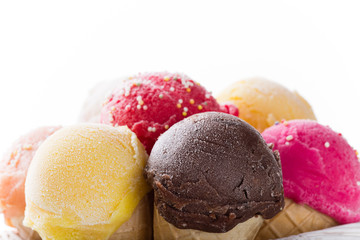 Ice cream scoops on wooden table.