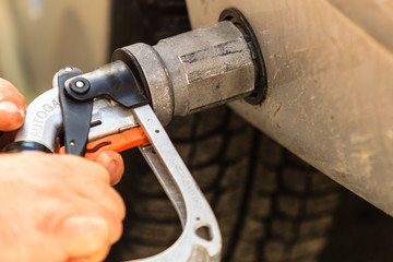 car at gas station being filled with fuel