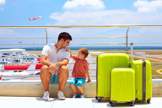 Family Waiting For Boarding In Airport, Summer Vacation