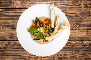 Clams. Venus clams in tomato sauce