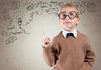 Kid. Portrait of male elementary school student with lightbulb