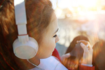 Spring portrait of the girl headphones music player concept