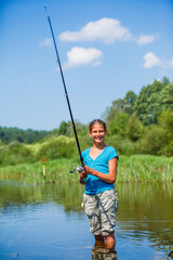 Girl fishing on the river.
