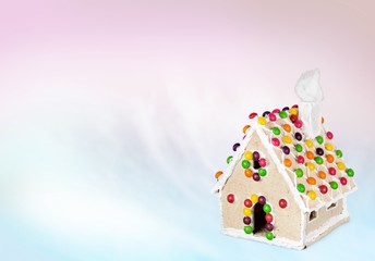 Gingerbread. Homemade gingerbread house on brown background
