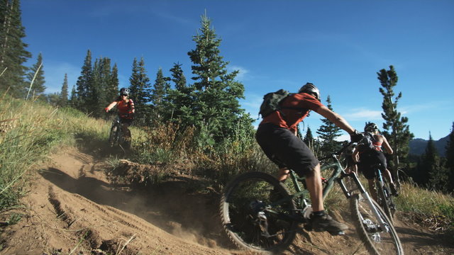 mountain bikers making a turn
