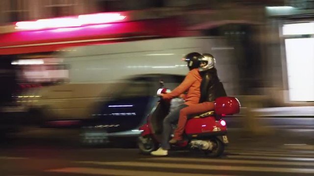 WS PAN Night street scene with couple on moped / Paris, France