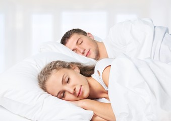 Fototapeta na wymiar Adult. Romantic young couple sleeping in bed