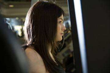 Fototapeta na wymiar Closeup of a young girl in the gym.