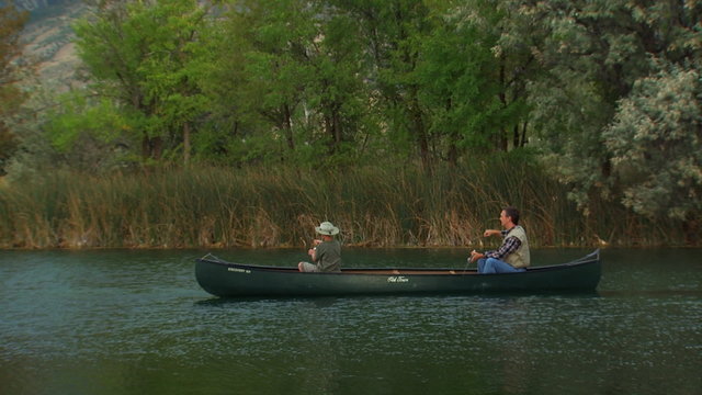 father and son in a canoe