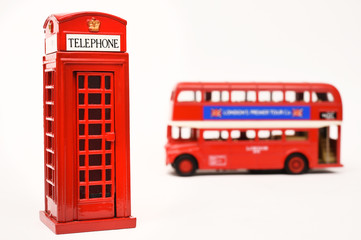 Fototapeta na wymiar Red telephone box and red bus