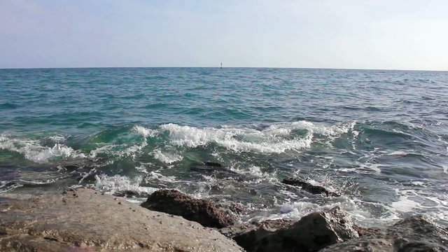 Sea waves crashing against rocks