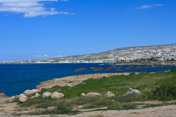 Fototapeta na wymiar Deserted beach on the background of the Mediterranean sea. Cyprus 