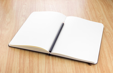 blank open notebook with black pencil on wood table,Business tem