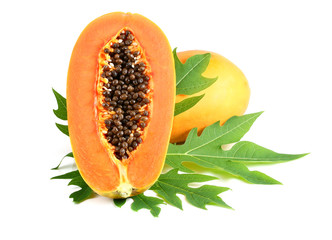 sweet papaya on the dish with green papaya leaf