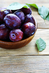 Freshly picked plums in a bowl