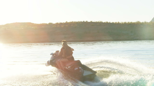 couple on a wave runner