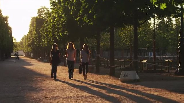 WS Three women walking in park / Jardin des Tuileries, Paris, France