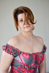 Portrait of  woman in a dress with bare shoulders