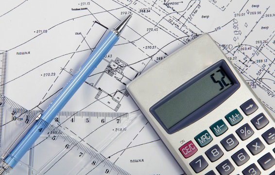 Drawing accessories and calculator on construction drawing