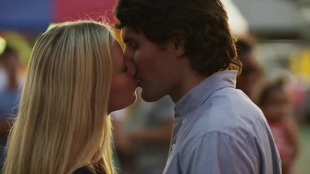 Close up, slow motion shot of young couple kissing / American Fork, Utah, United States