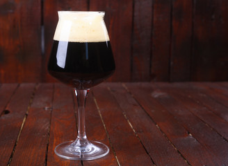 Dark beer on wood