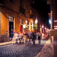 Group of People walking in Lisbon at night