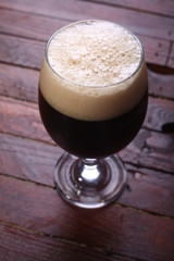 Dark beer on wood