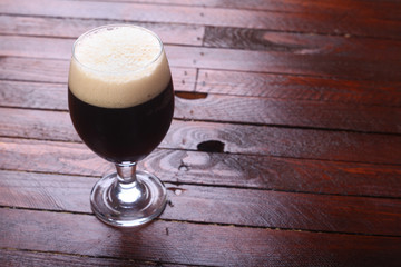 Dark beer on wood
