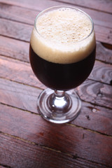 Dark beer on wood