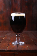 Dark beer on wood