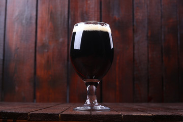 Dark beer on wood