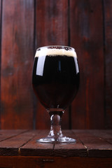 Dark beer on wood