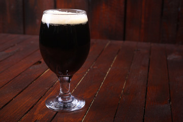 Dark beer on wood