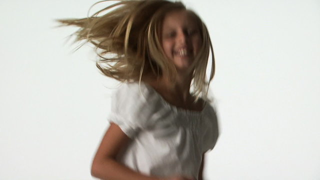 A young girl jumping around
