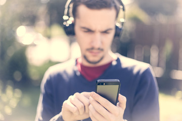 Man listening to the music with bluetooth technology
