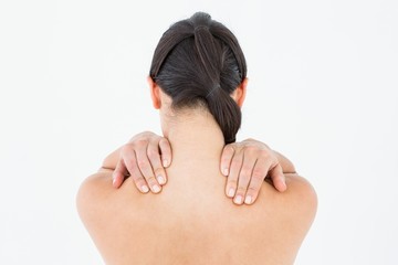 Obraz premium Brunette touching her painful shoulders
