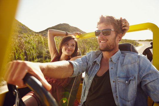 Loving young couple on road trip