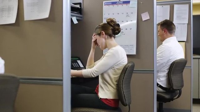 MS ZI Tired woman working at desk in office / Orem, Utah, USA