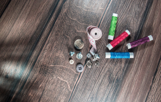 Thread and buttons, tools for tailor