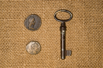 Antique  coins  and keys  on old cloth