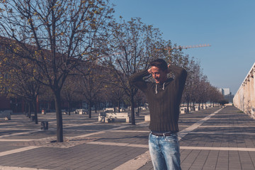 Young  man posing in an urban context