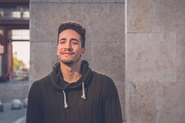 Young  man posing in an urban context