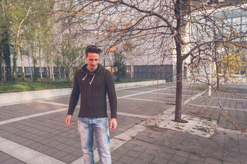 Young  man posing in an urban context