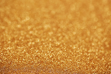 Gold nuggets sparkling carpet. Close-up view, very shallow deep