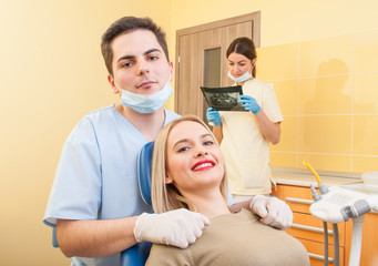 Fototapeta premium Male dentist doctor and happy patient