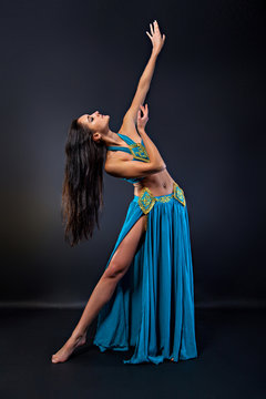 Young beautiful woman in oriental dance